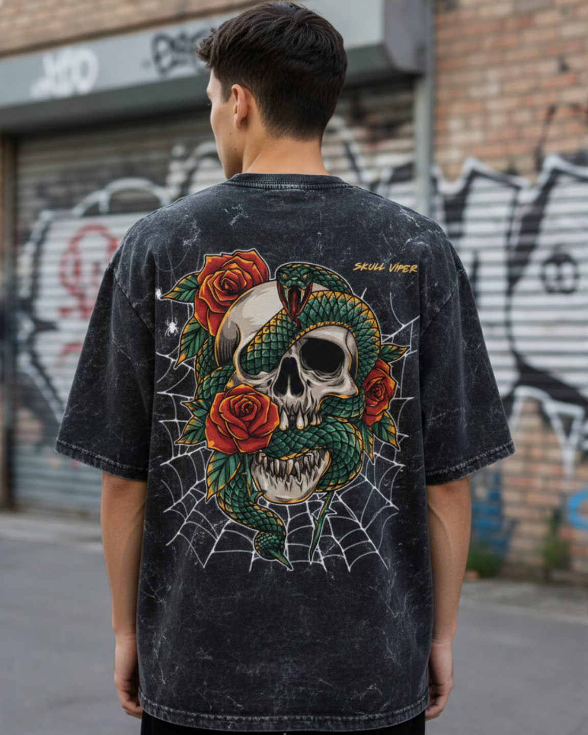 Person wearing a black t-shirt with a colorful skull and roses design, standing in an urban setting.